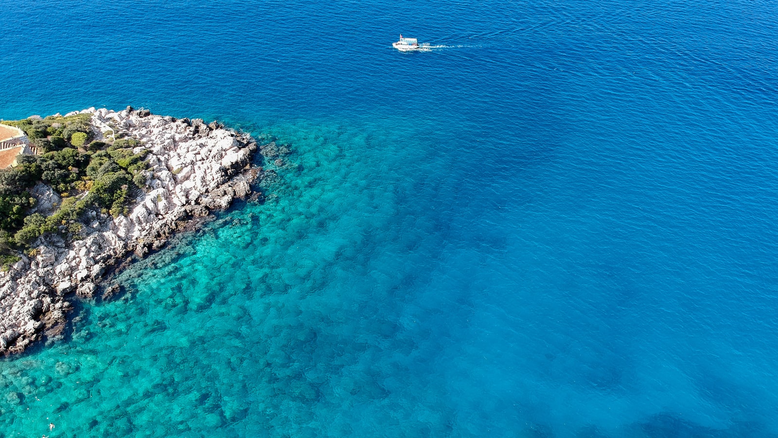Turquoise Mediterranean coast of Antalya with cliffs and blue water