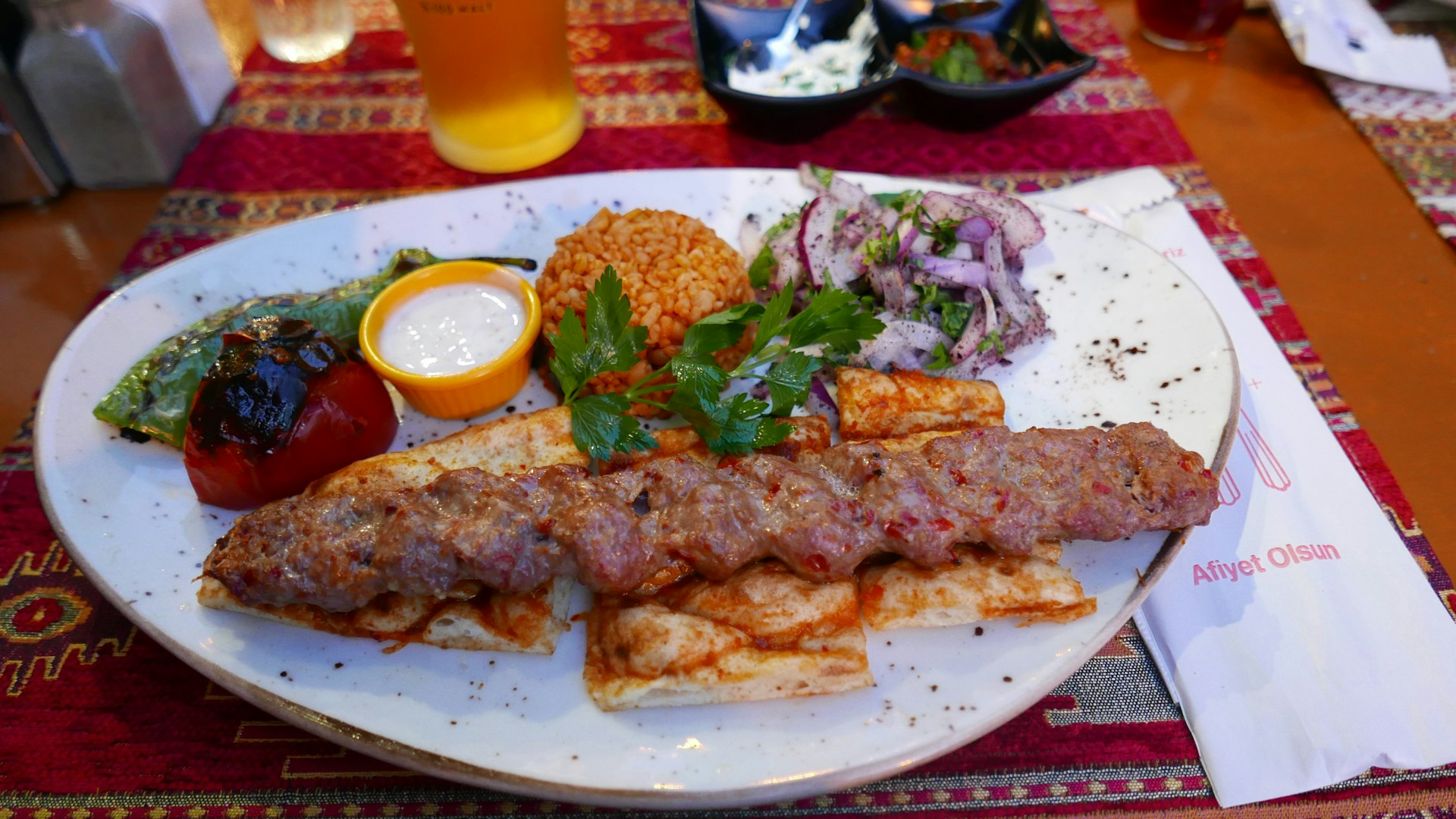 Spread of Turkish meze dishes on a table with bread and salads